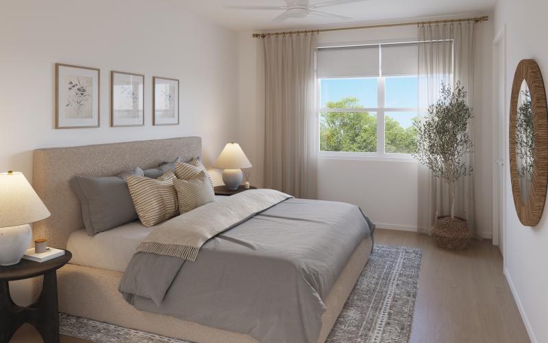 a bedroom with a bed and a window